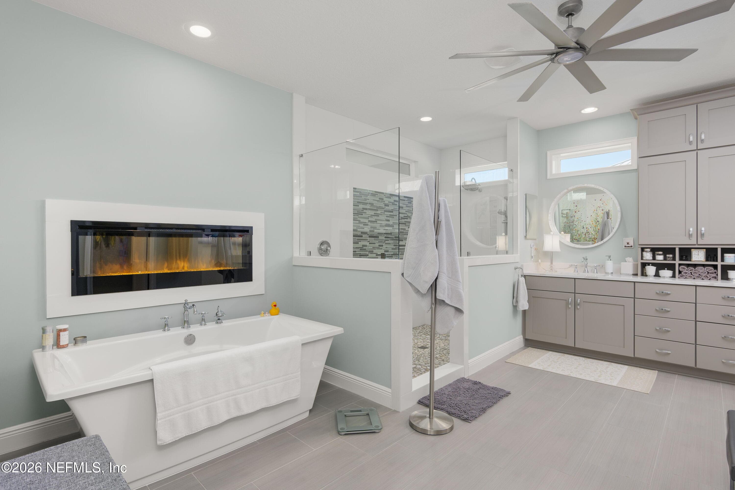 Spa-Inspired Main Bathroom with Fireplace — 703 RUM RUNNER Way, St. Johns, FL 32259