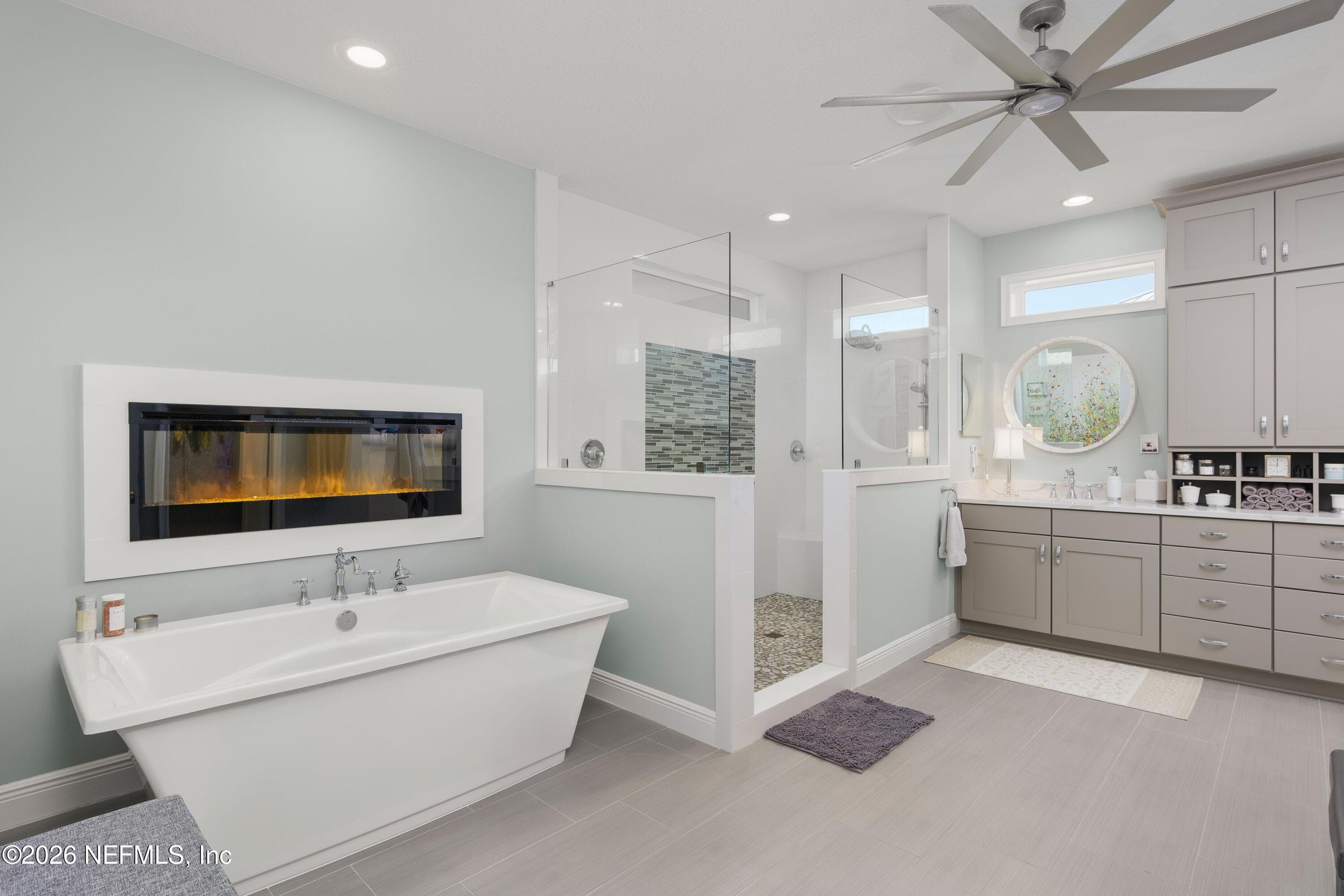 Spa inspired bath with dreamy bathtub and fireplace and huge separate shower — 703 RUM RUNNER Way, St. Johns, FL 32259