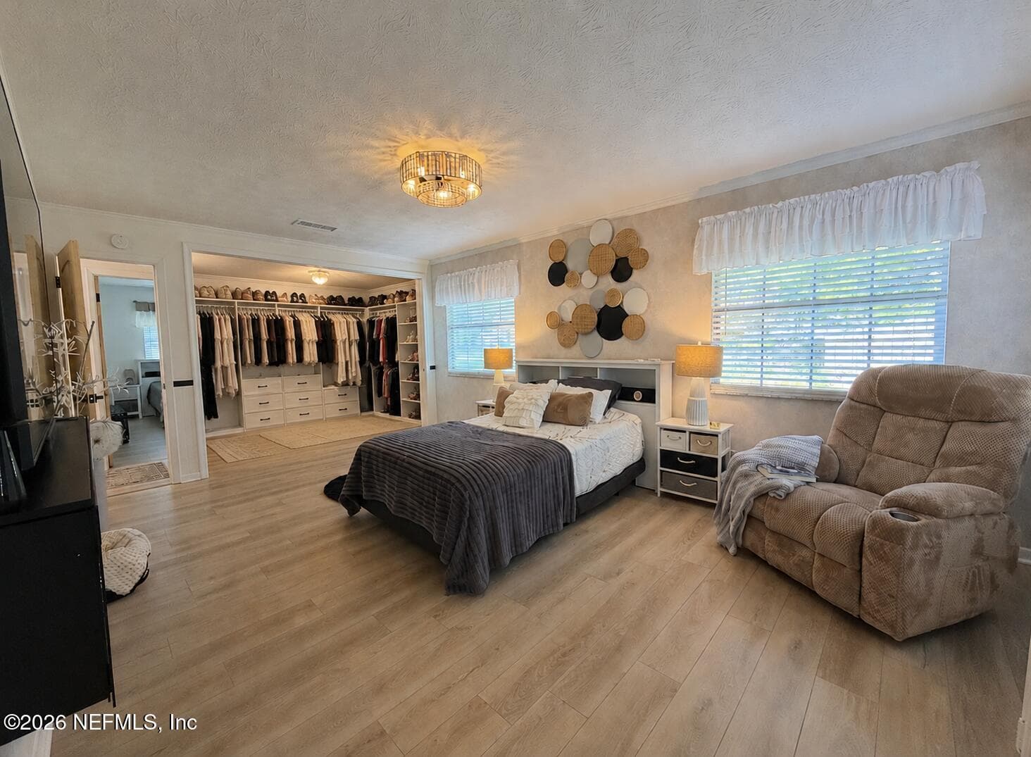 AI image of remodel, opening wall and using the bedroom 2 closet for the primary — 332 WHISPERING WOODS Drive, Fleming Island, FL 32003