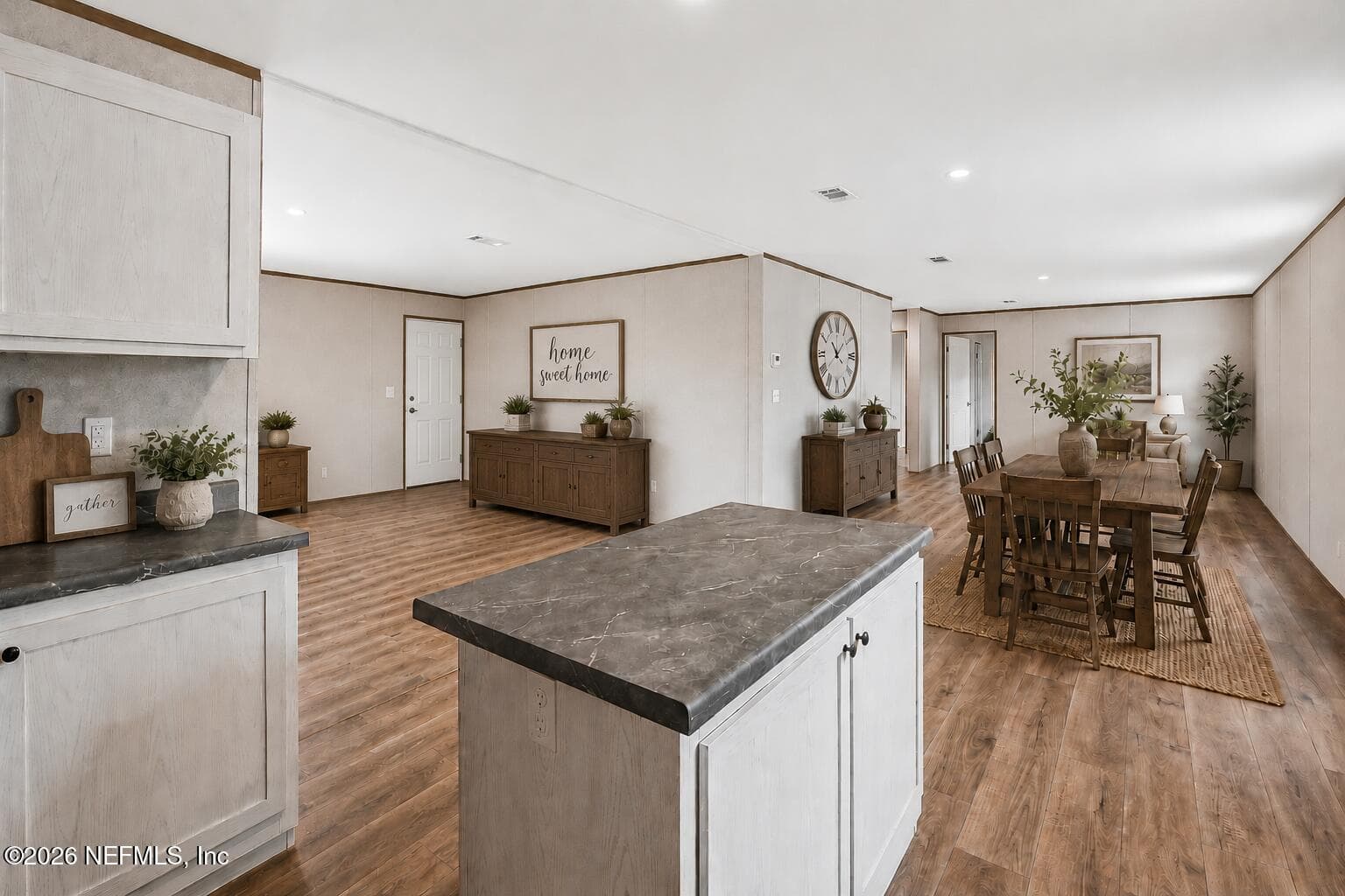 open floor plan view to living and dining areas virtually staged — 6771 SW COUNTY ROAD 225, Starke, FL 32091
