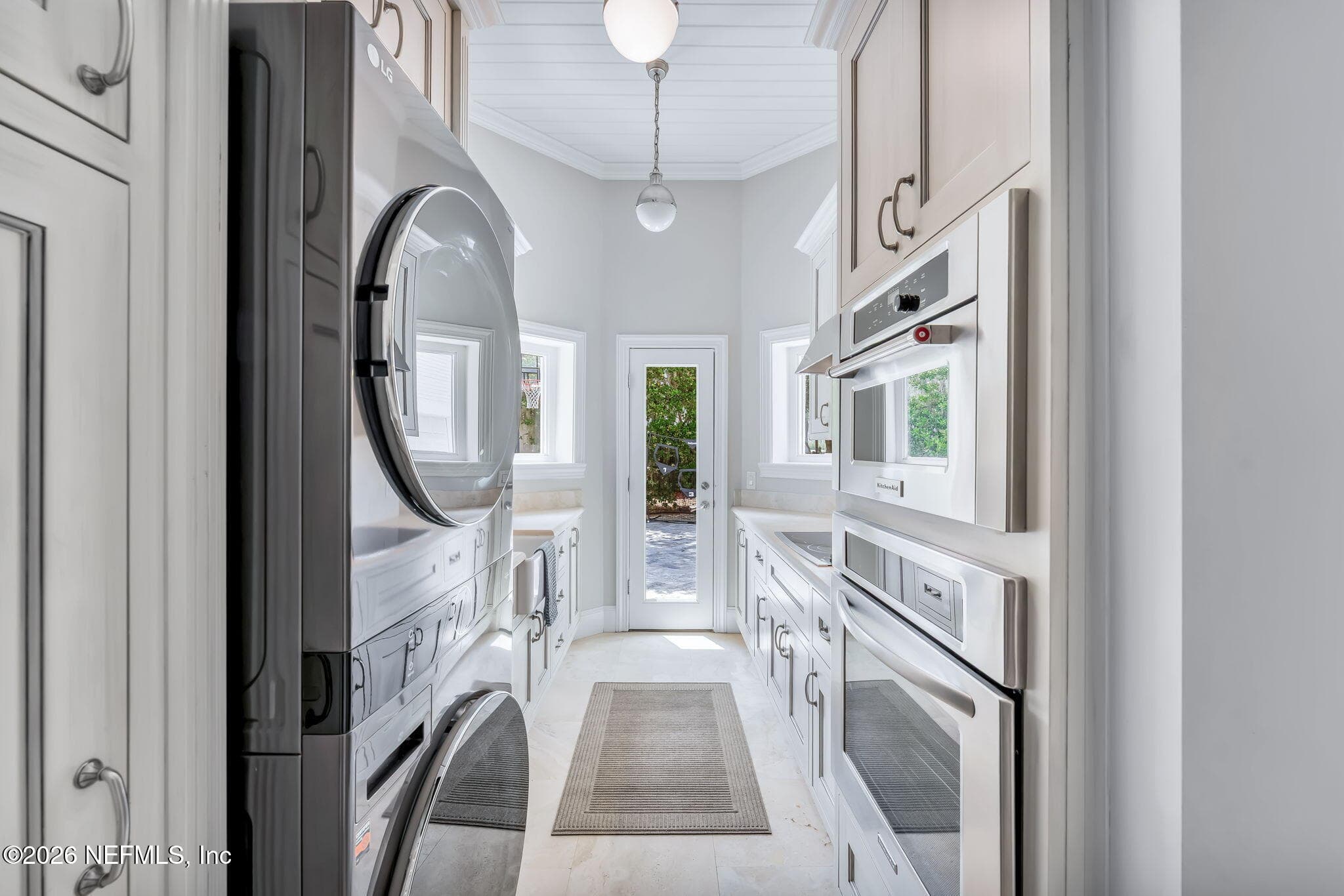 The scullery kitchen features a washer and dryer, refrigerator, dishwasher, oven, cooktop, ample storage and more! — 149 BRISTOL Place, Ponte Vedra Beach, FL 32082