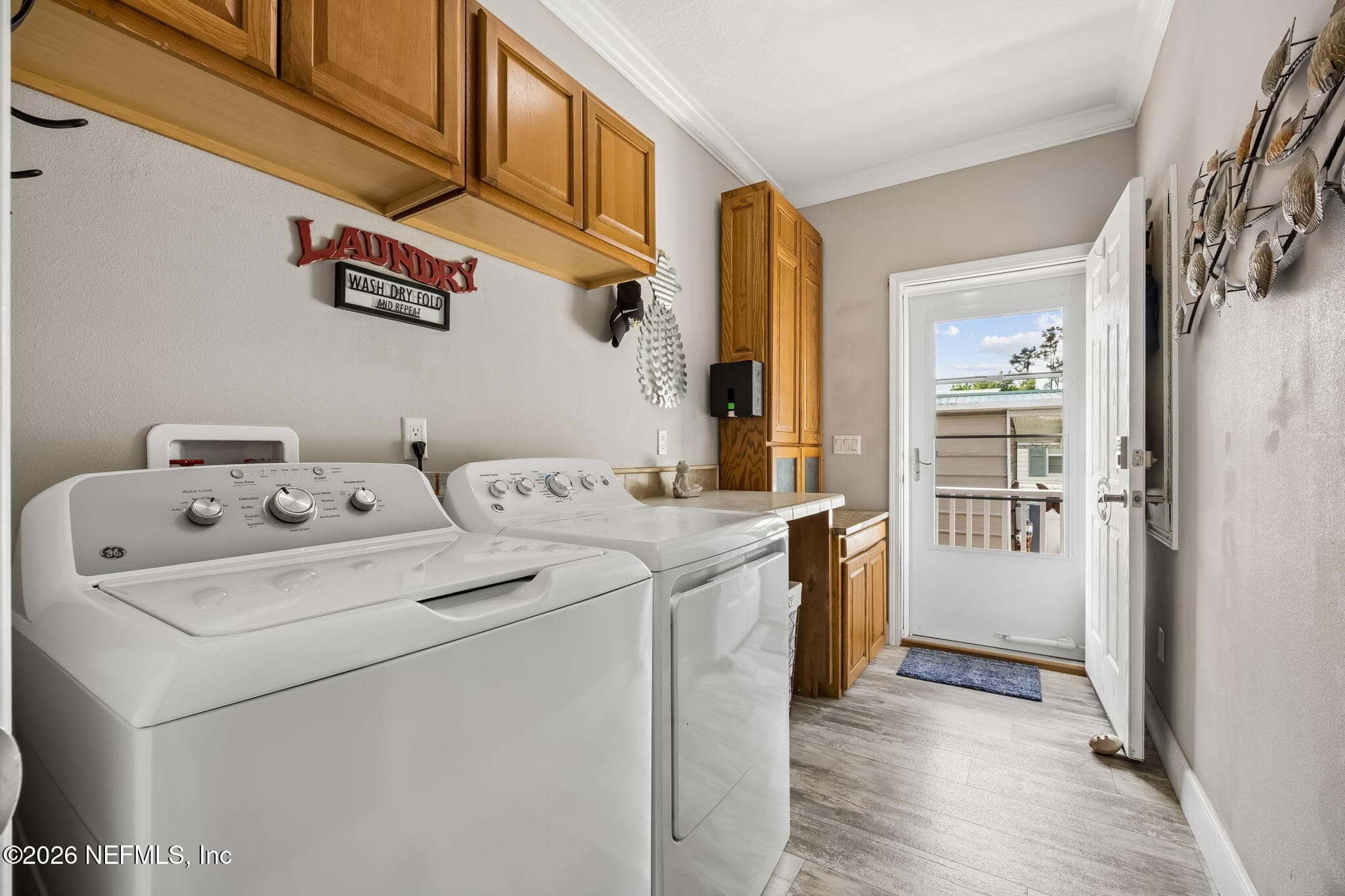 Laundry Room W/Outside Exit — 329 PARADISE Circle, Satsuma, FL 32189