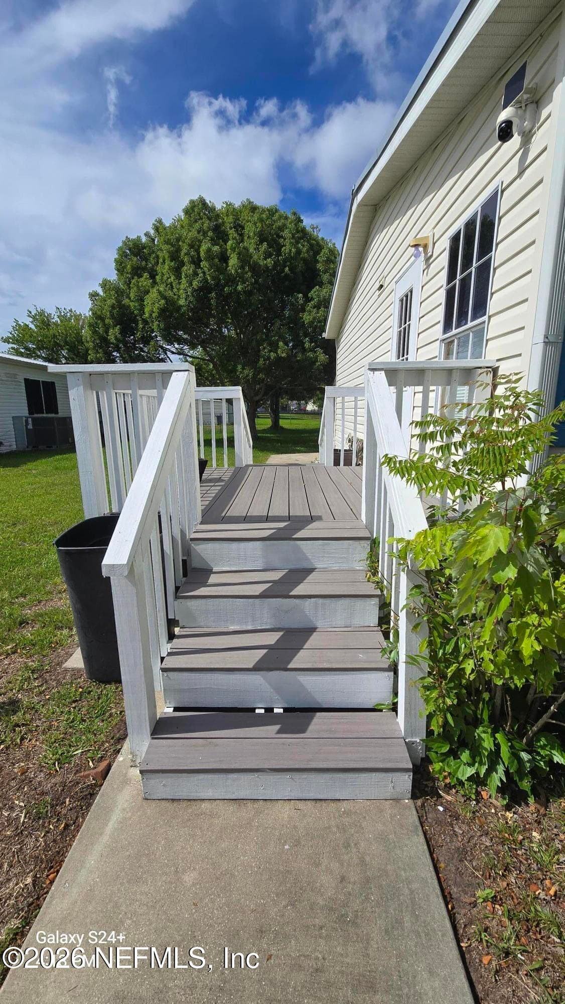 2204 Whippoorwill Dr, St Augustine, FL - Side entrance with dual side stairs — 2204 WHIPPOORWILL Drive, St. Augustine, FL 32084