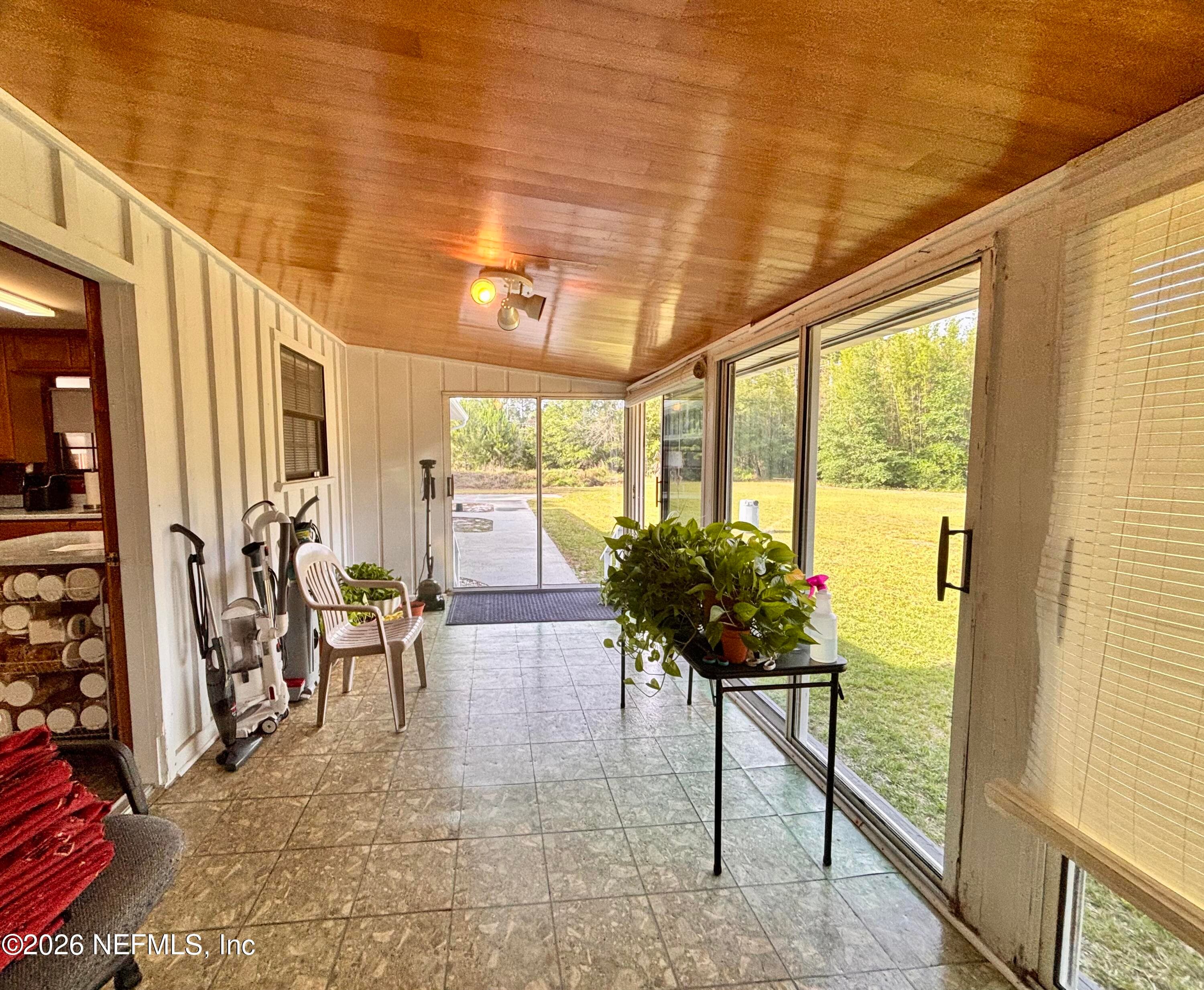 Sunroom off of kitchen — 941222 OLD NASSAUVILLE Road, Fernandina Beach, FL 32034