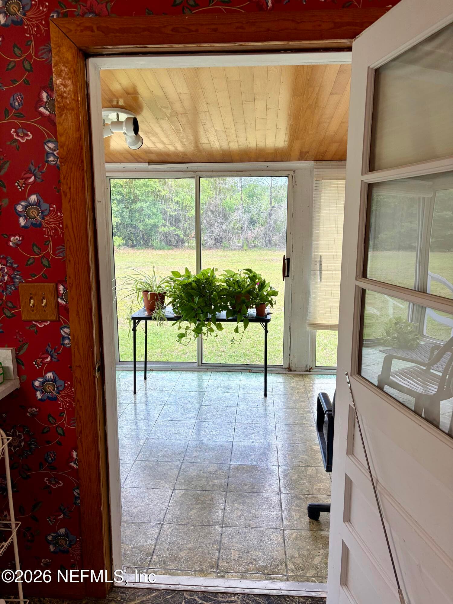From kitchen into back sunroom — 941222 OLD NASSAUVILLE Road, Fernandina Beach, FL 32034
