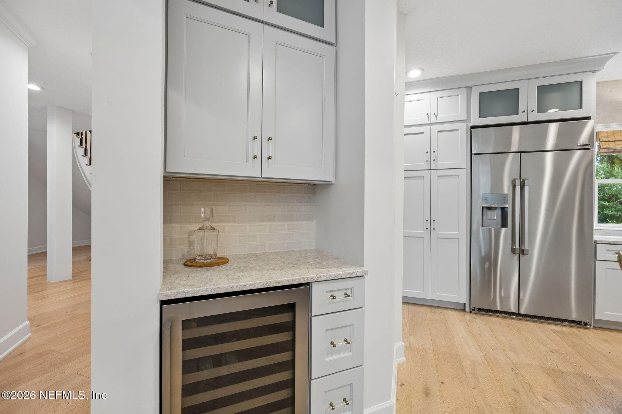 A built-in beverage station with wine refrigeration adds both style and convenience to this thoughtfully designed kitchen. — 5070 BENTGRASS Circle, Ponte Vedra Beach, FL 32082