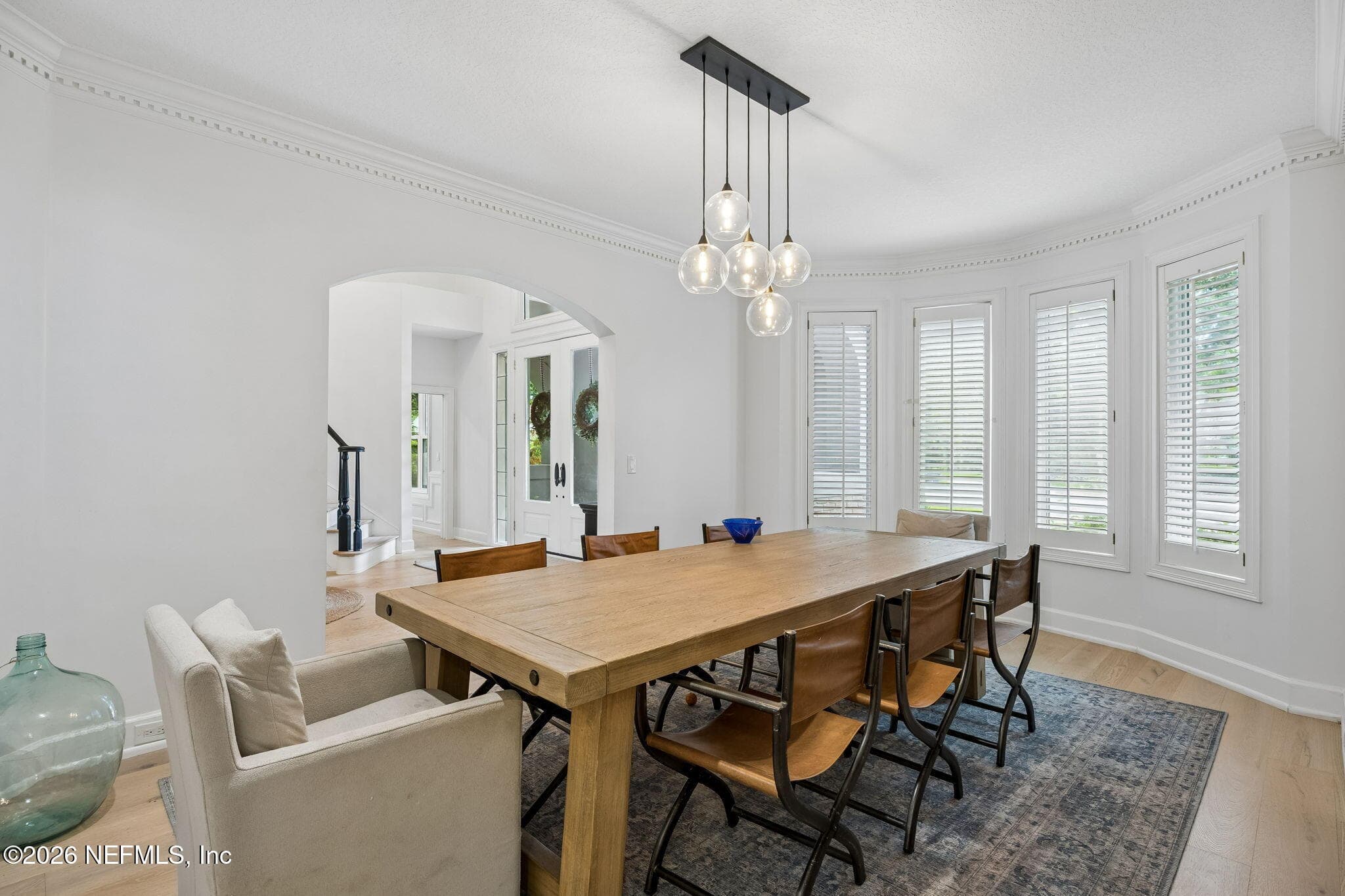 Formal dining room with refined architectural details like dental molding that create a bright and inviting entertaining space. — 5070 BENTGRASS Circle, Ponte Vedra Beach, FL 32082