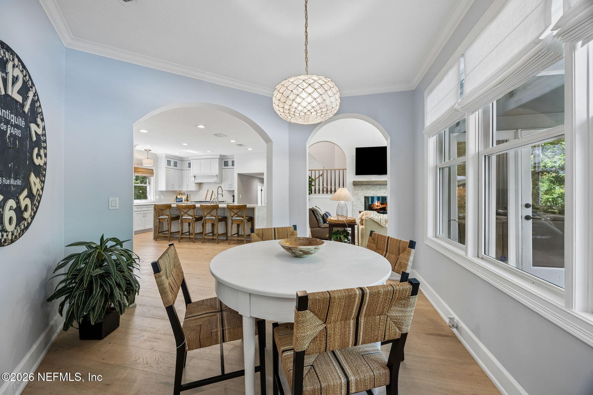 Bright and airy dining space with soft coastal tones, elegant archways, and seamless flow into the chef’s kitchen and living areas. — 5070 BENTGRASS Circle, Ponte Vedra Beach, FL 32082