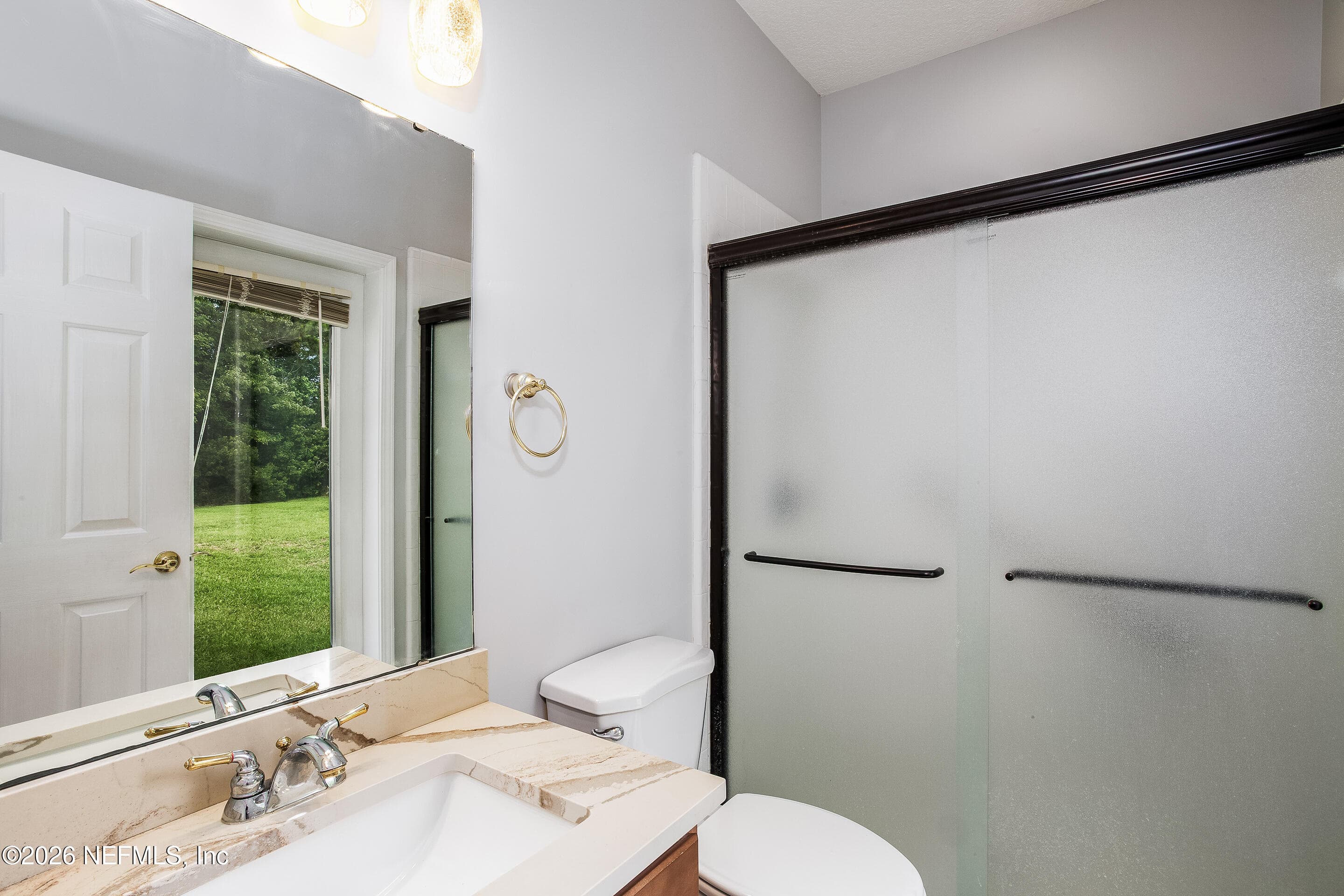 Hall Bath With Exterior Door — 6197 KISSENGEN SPRING Court, Jacksonville, FL 32258