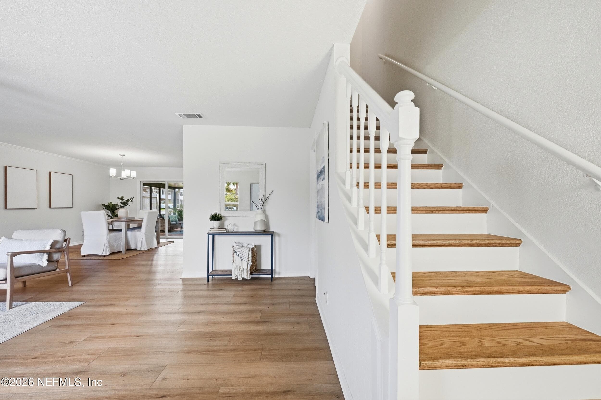 Step through the front door and be greeted by stunning wide-plank oak luxury vinyl flooring that sets the tone for the beautifully updated interior. — 695 N A1A 25, Ponte Vedra Beach, FL 32082