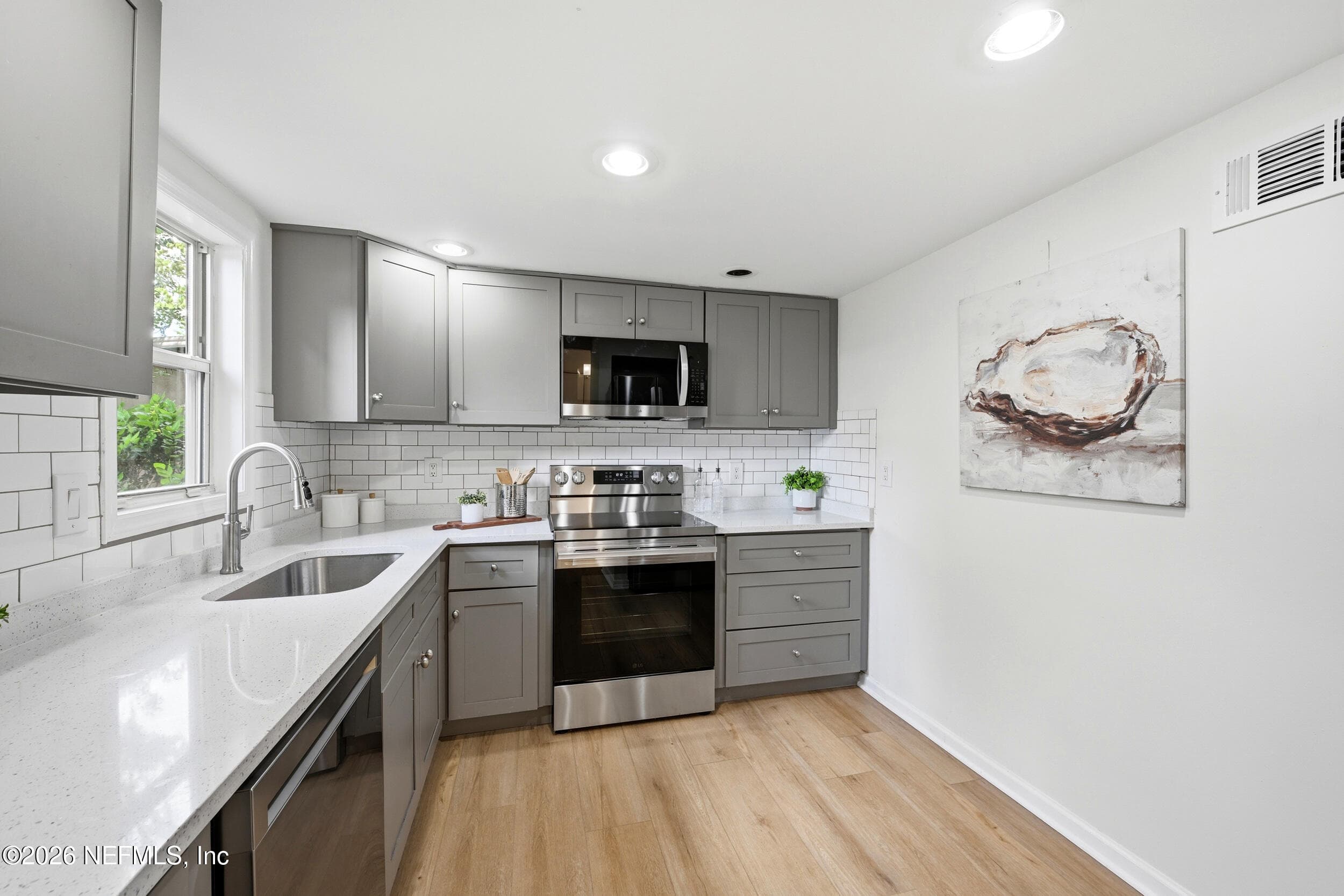 Brand-new LG stainless steel appliance package including refrigerator, stove, dishwasher, and microwave, plus a newly added pantry for extra storage. — 695 N A1A 25, Ponte Vedra Beach, FL 32082