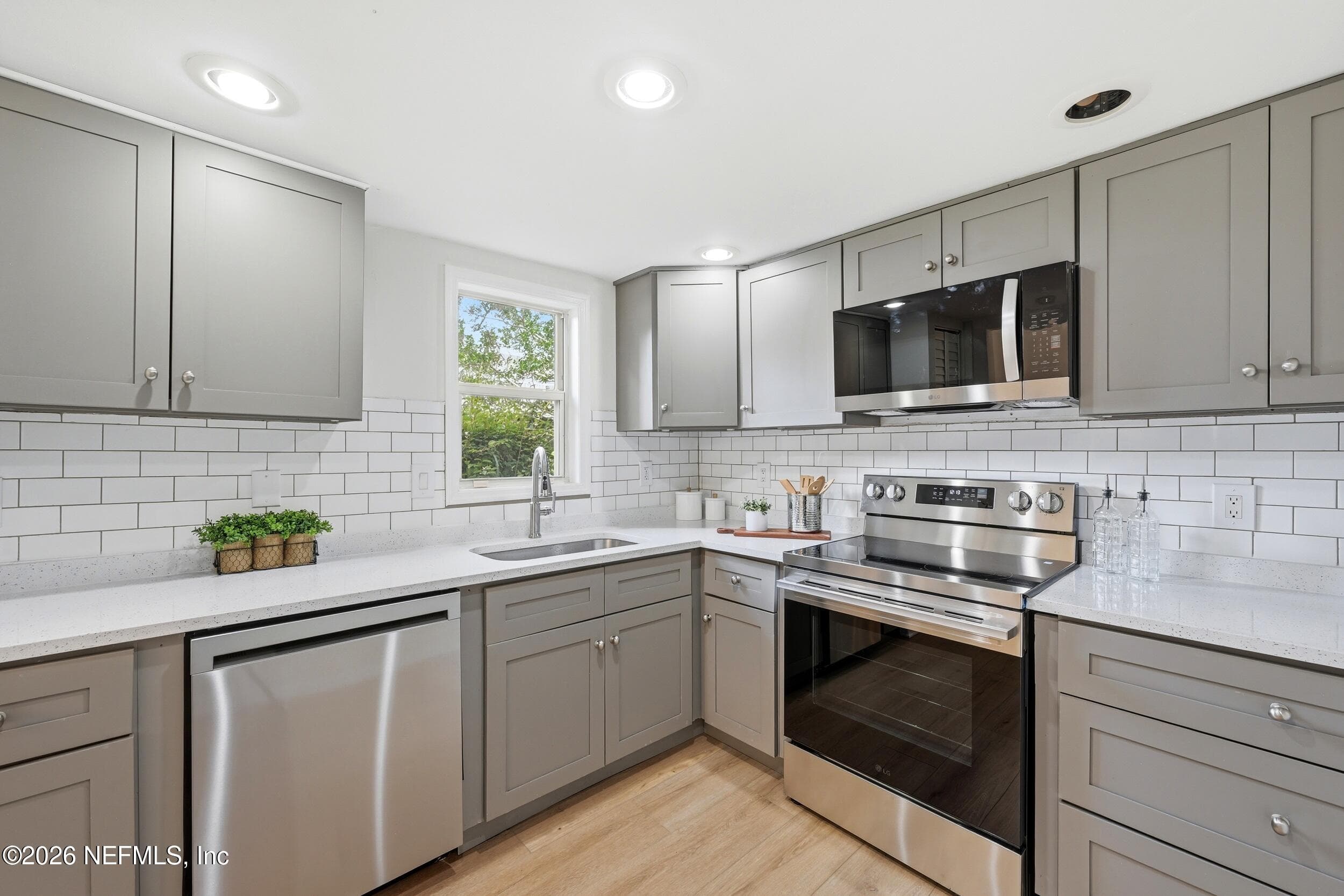 Brand-new LG stainless steel appliance package including refrigerator, stove, dishwasher, and microwave, plus a newly added pantry for extra storage. — 695 N A1A 25, Ponte Vedra Beach, FL 32082
