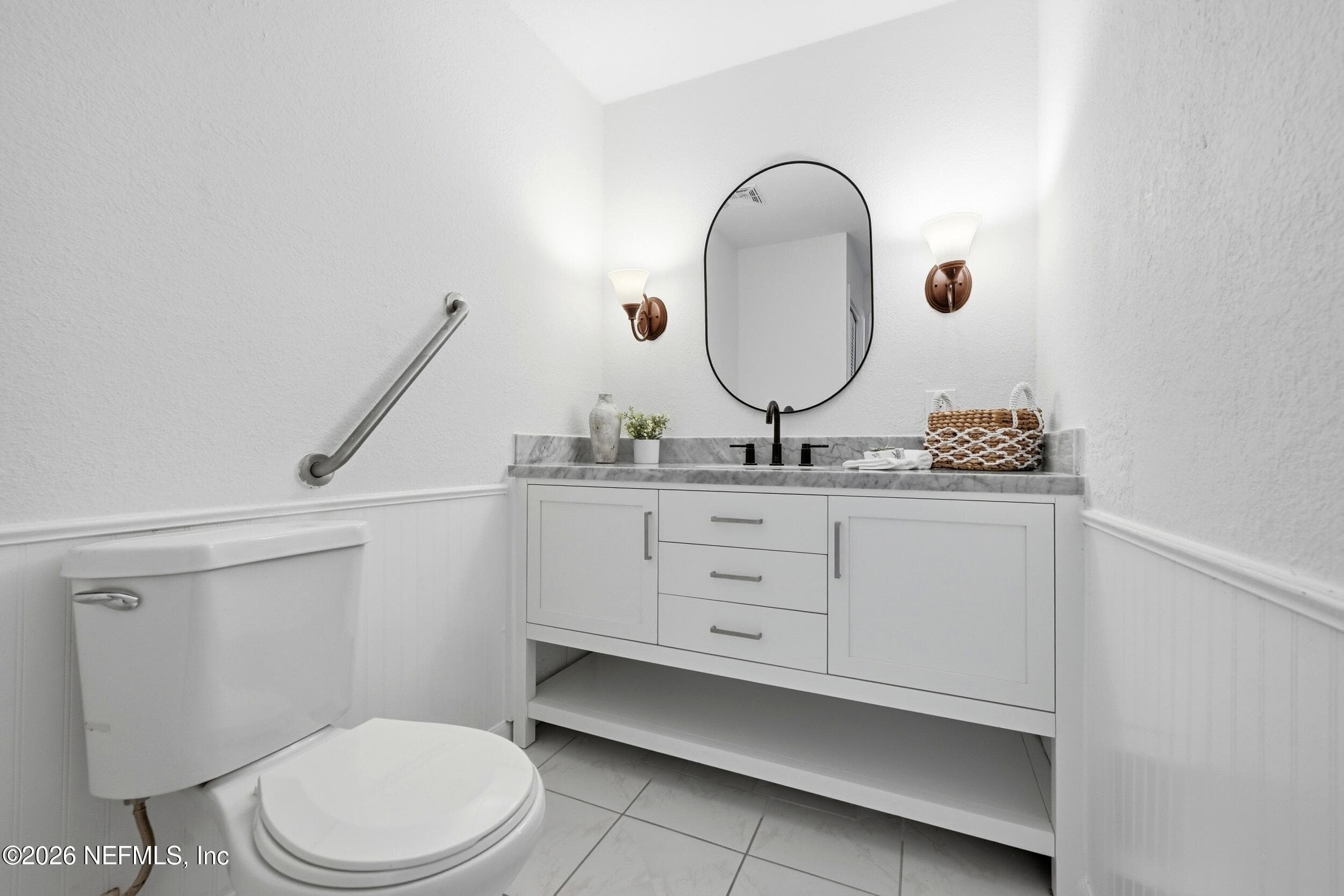 Guest bath refreshed with a new vanity, updated mirror, and fresh paint, creating a clean, inviting space your guests will appreciate. — 695 N A1A 25, Ponte Vedra Beach, FL 32082