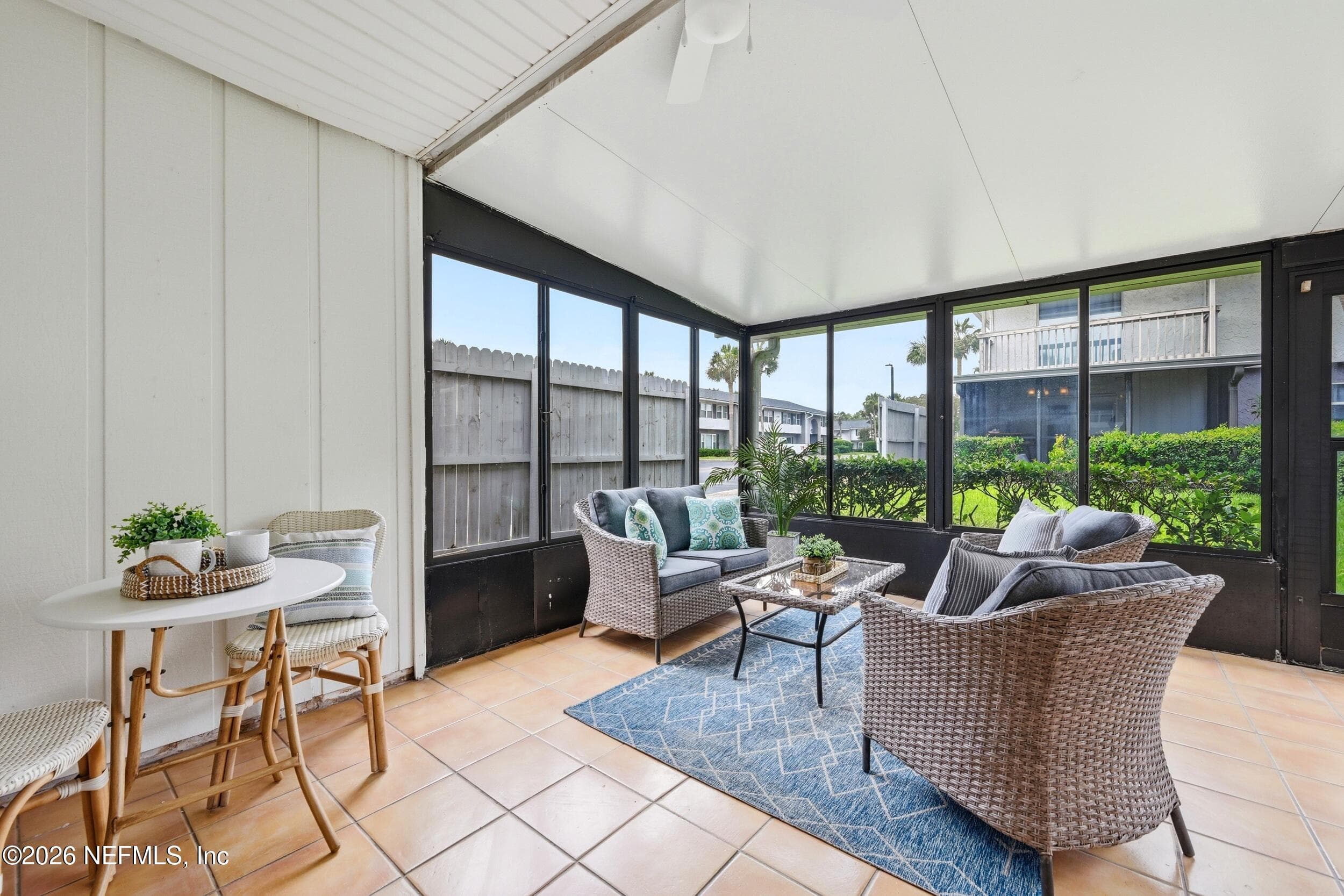The Florida Room offers the perfect retreat for morning coffee, afternoon reading, or additional living space. — 695 N A1A 25, Ponte Vedra Beach, FL 32082
